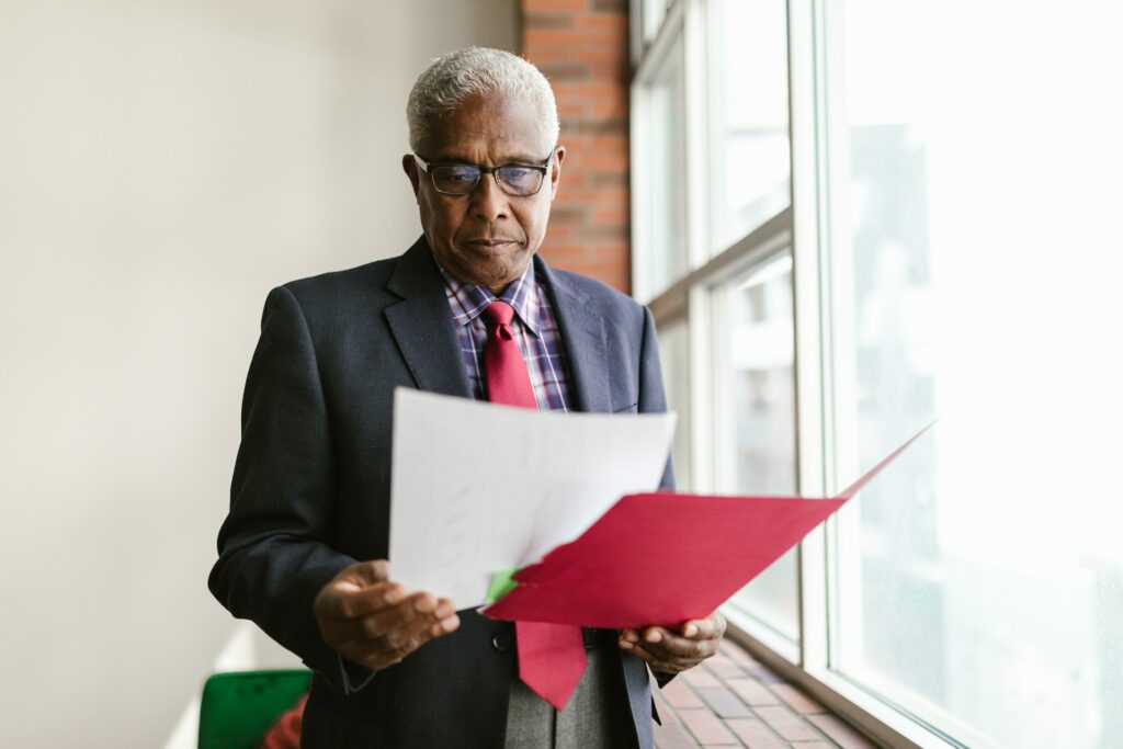 Managerial candidate looking over a detailed job description.