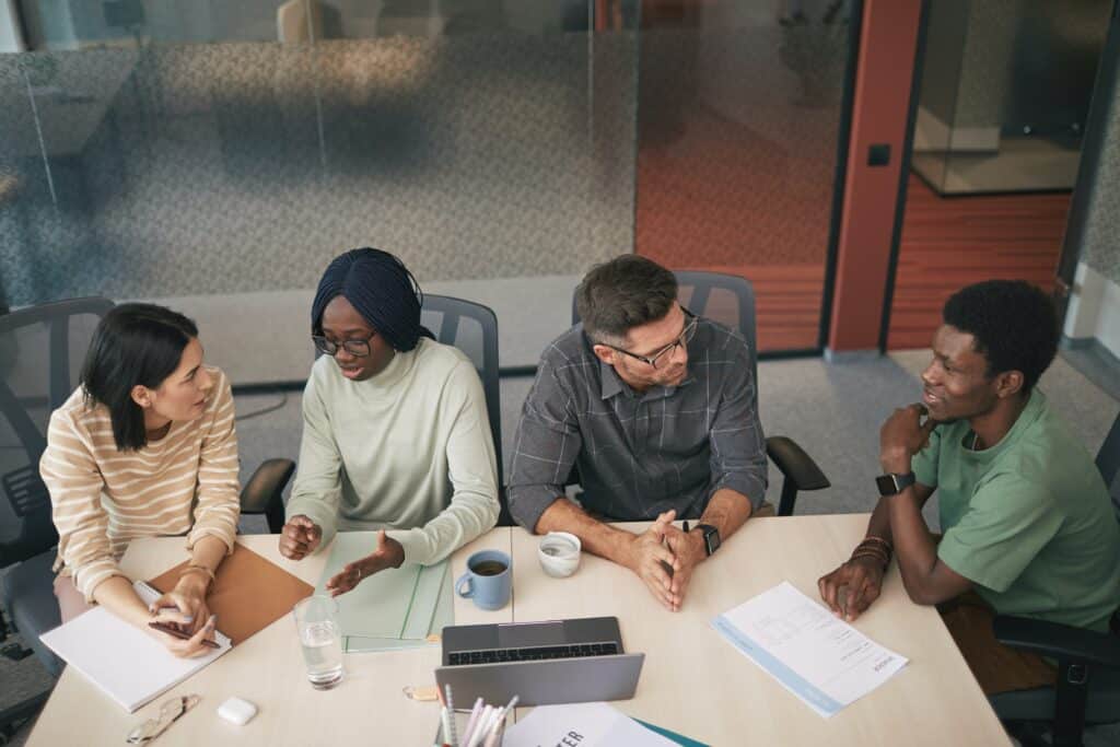 4 people working together